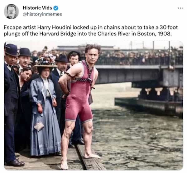 Escape artist Harry Houdini locked up in chains about to take a 30 foot plunge off the Harvard Bridge into the Charles River in Boston, 1908.