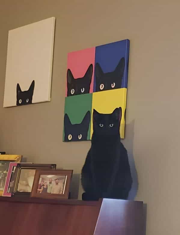 accidental camouflage cat hiding in painting