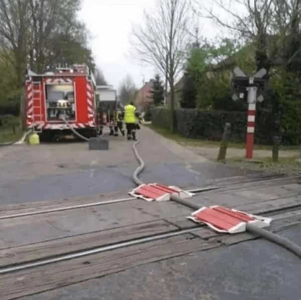 cursed images firetruck hose on train track