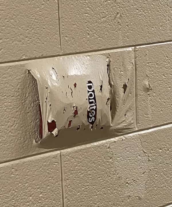 cursed images Dorito bag in wall paint