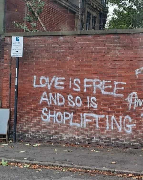 funny graffiti LOVE IS FREE AND So I SHOPLIFT IN