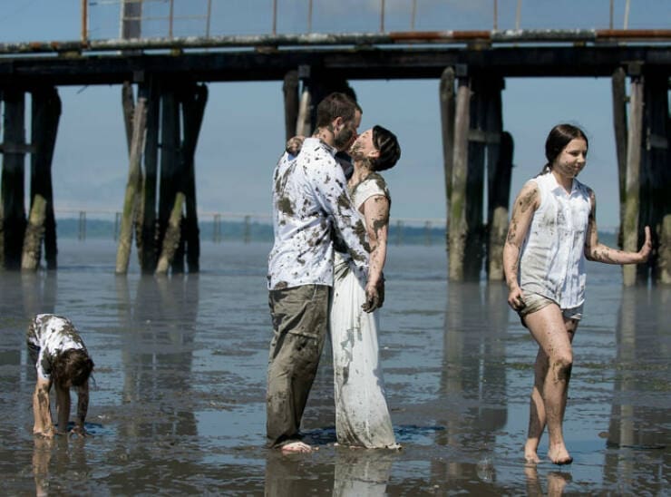Awkward family photos beach covered in mud