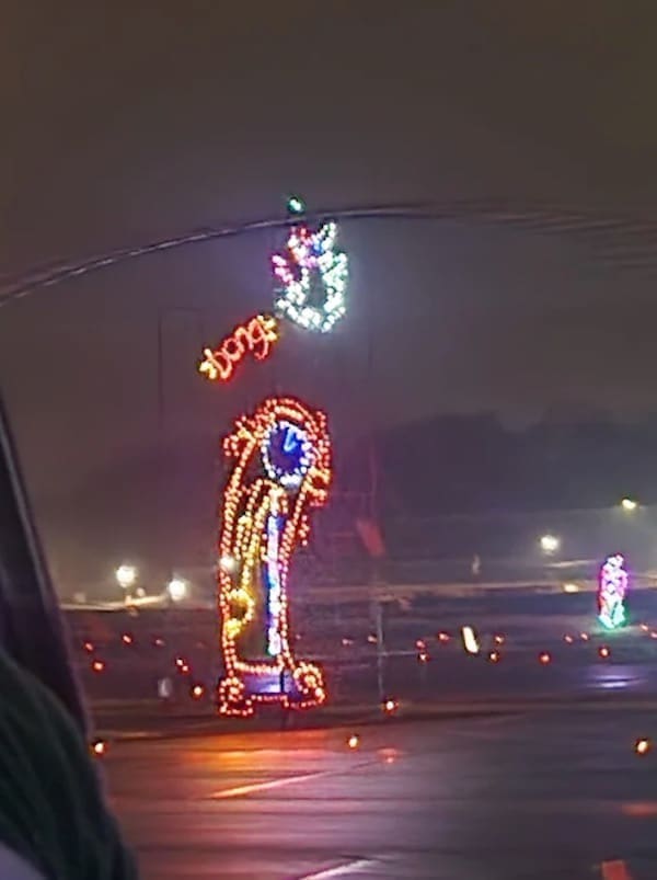 phallic Christmas decorations parking lot lights