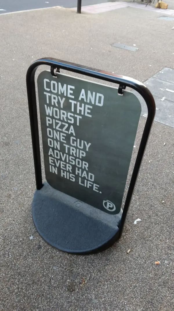 funny restaurant signs COME AND TRY THE WORST PIZZA ONE GUY ON TRIP advisor ever had in his life