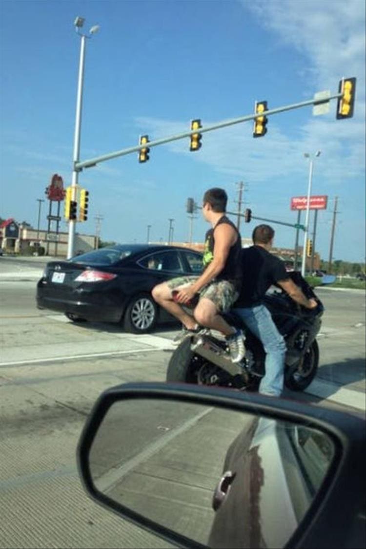 two guys on motorcycle unsafe