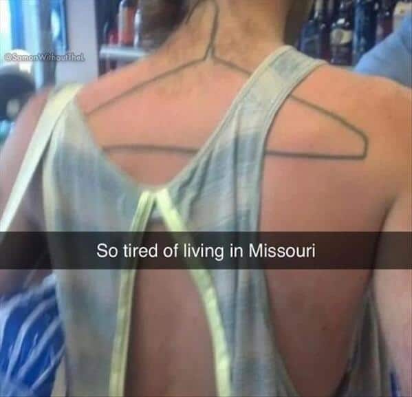 So tired of living in Missouri. Back coat hanger tattoo