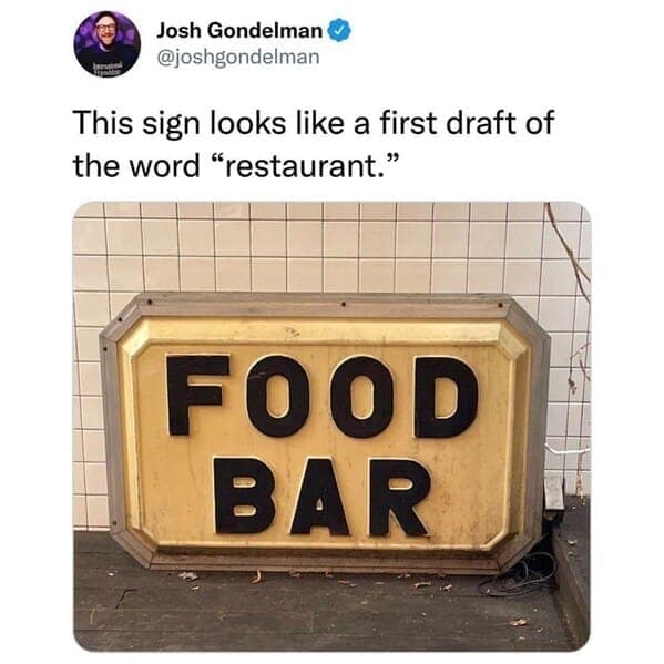 This sign looks like a first draft of the word "restaurant." FOOD BAR