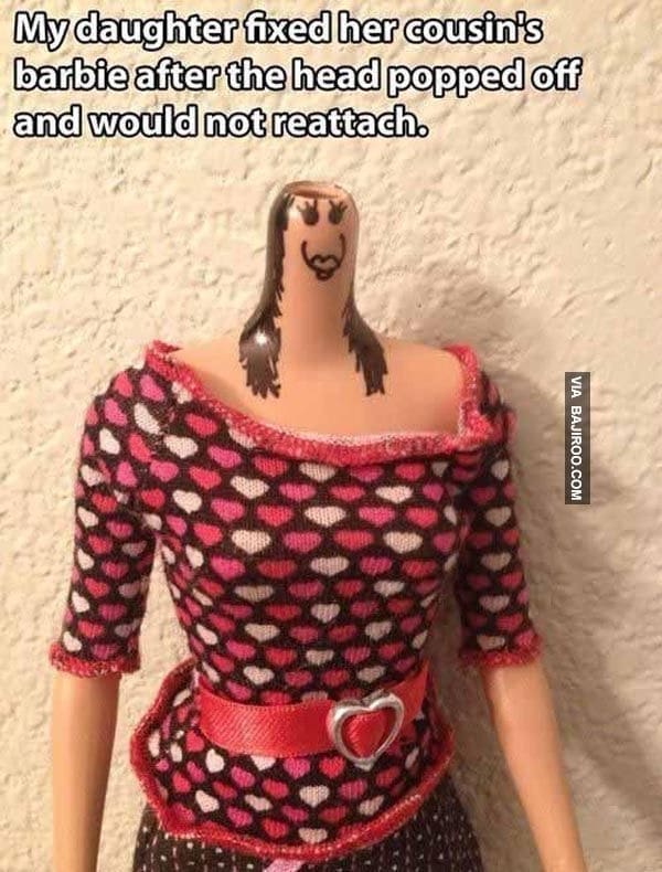 Barbie doll with face drawn on neck after head popped off