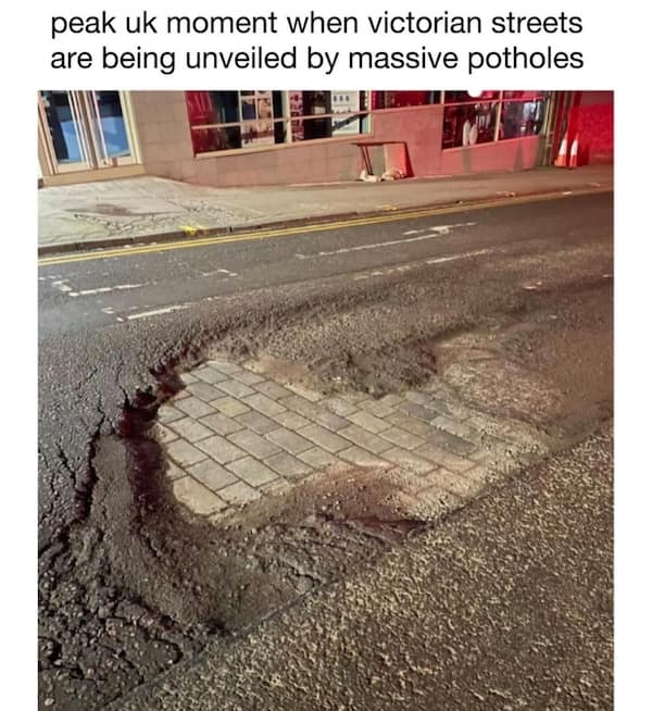 British memes photo of confusing road markings reading “TURN” with arrows pointing both left and right
