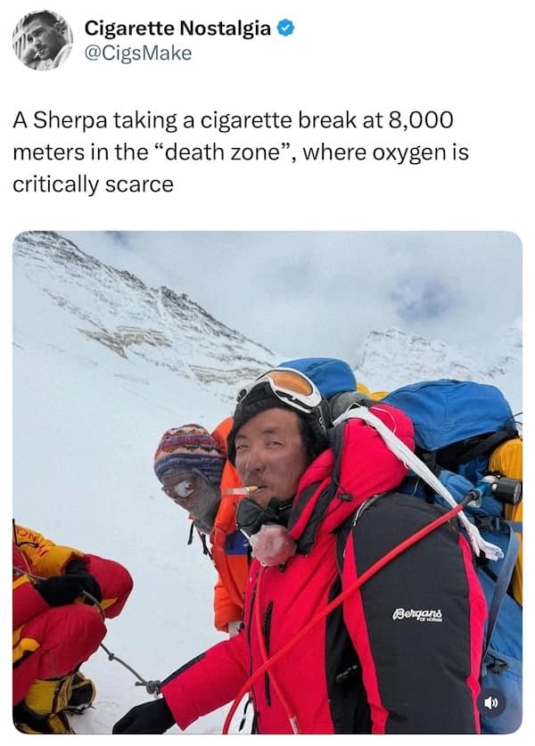 Sherpa smoking a cigarette during mountain climb at high altitude