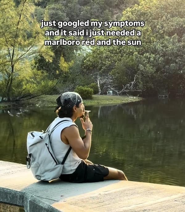 Man sitting by water smoking with caption about Marlboro Reds and sunshine as therapy