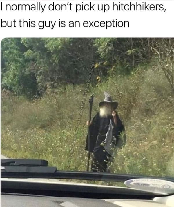 A man dressed as a wizard walking on the roadside, with the caption “I normally don’t pick up hitchhikers, but this guy is an exception.”