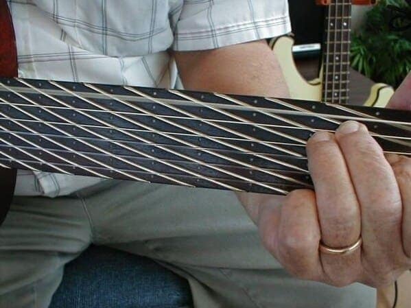 cursed instruments, instruments with threatening auras, weird instruments, instrument fails, bizarre music, odd instruments, performance art, music gadgets, funny instrument photos, experimental music, custom instruments, music humor, instrument design, odd musical gear, creepy instruments