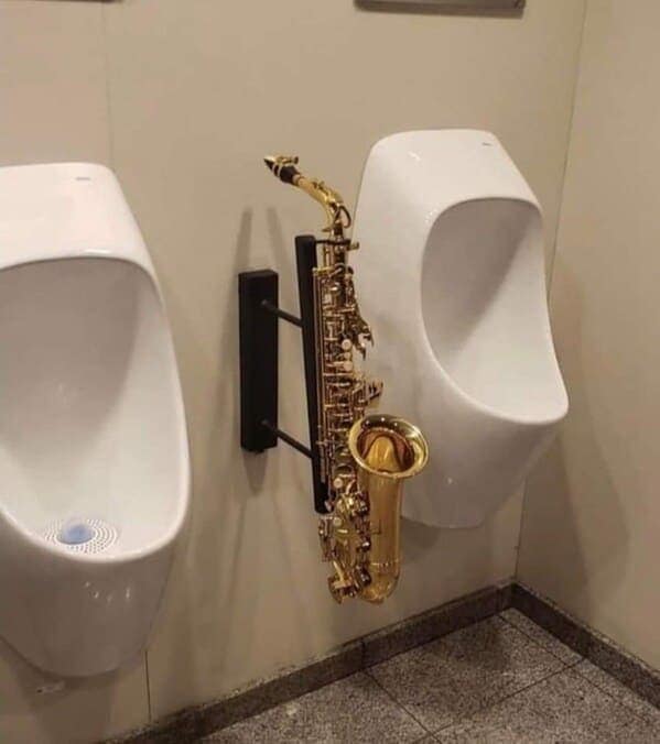 cursed instruments, instruments with threatening auras, weird instruments, instrument fails, bizarre music, odd instruments, performance art, music gadgets, funny instrument photos, experimental music, custom instruments, music humor, instrument design, odd musical gear, creepy instruments