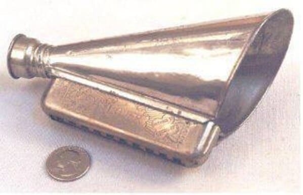 cursed instruments, instruments with threatening auras, weird instruments, instrument fails, bizarre music, odd instruments, performance art, music gadgets, funny instrument photos, experimental music, custom instruments, music humor, instrument design, odd musical gear, creepy instruments