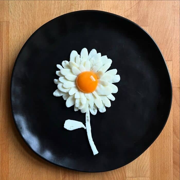 Fried egg designed as a daisy flower with yolk center