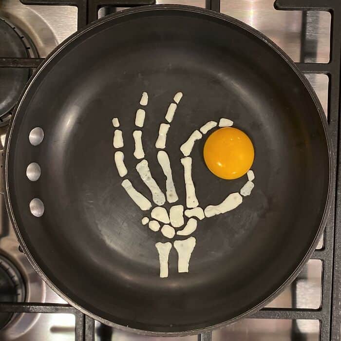 Skeleton hand formed with egg whites making an okay sign