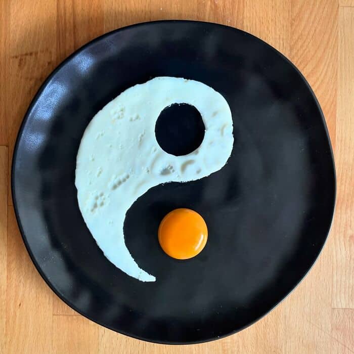 Fried egg arranged in the shape of a yin-yang symbol