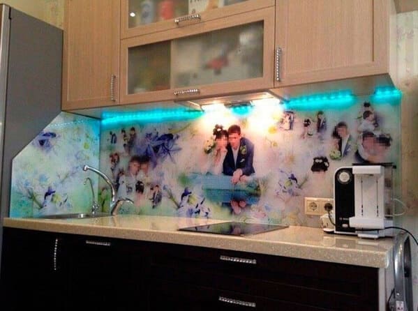 Kitchen backsplash decorated with a full-sized photo collage of a couple’s wedding