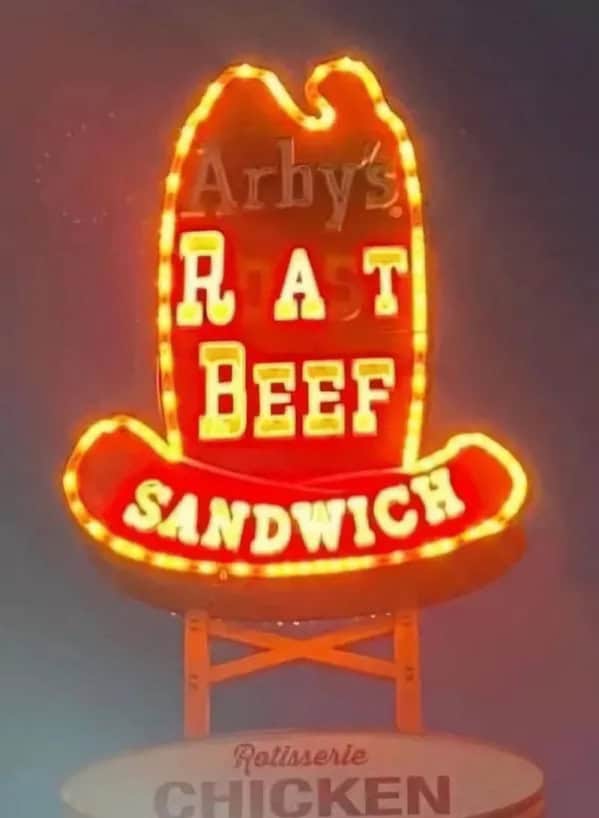 Arby’s neon sign with missing letters reading "Rat Beef Sandwich"