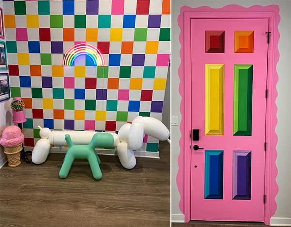 Rainbow wall decor and playful balloon dog statues in a modern room