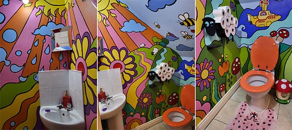 Psychedelic bathroom mural with bright cartoon flowers and bees