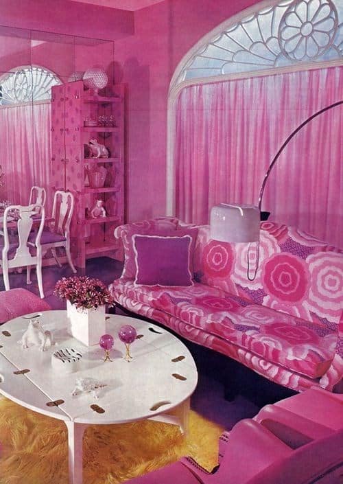 Pink retro living room with vintage couch and vibrant decor