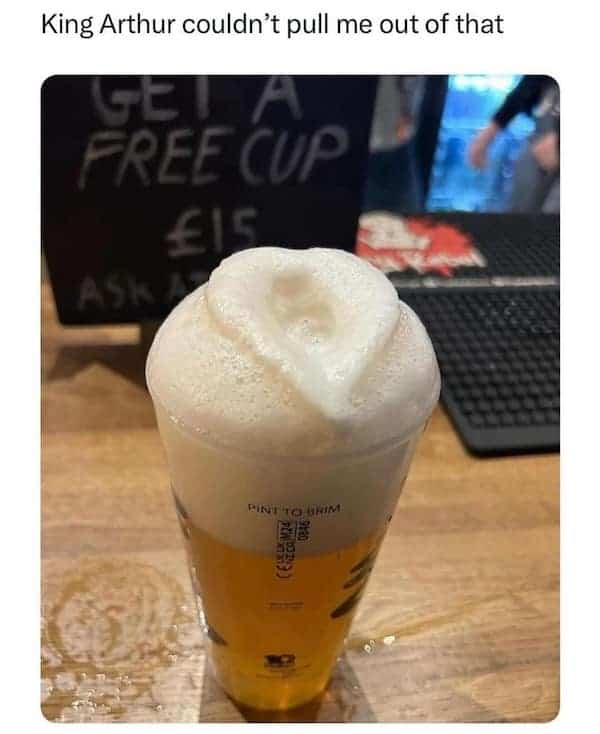 Beer with foam shaped like a heart.