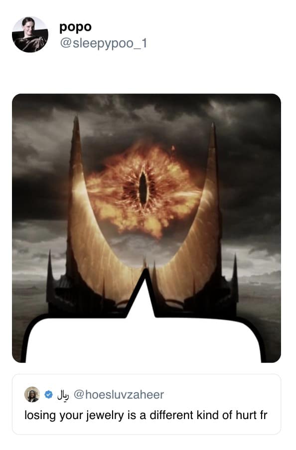 Fiery, slit-pupil eye blazing atop a black tower under stormy skies, framed by jagged spires and a speech bubble.