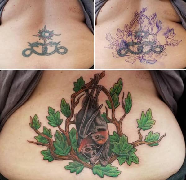 Colorful bat and leaves tattoo cover up replacing small floral and snake chest design.