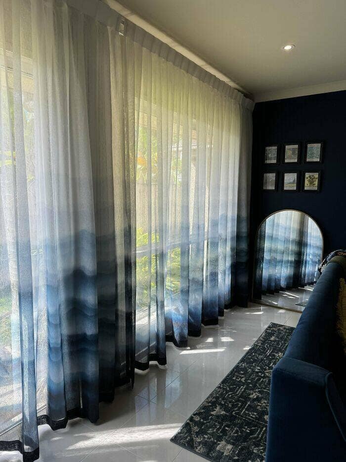 Amazing home decor pictures: airy living room with blue ombré sheer curtains and arched mirror