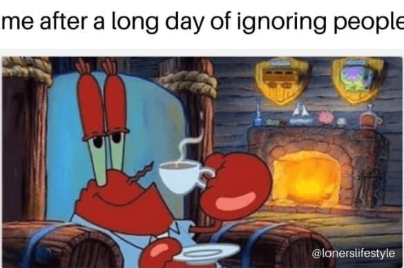 Mr. Krabs relaxes by fireplace sipping tea in armchair.