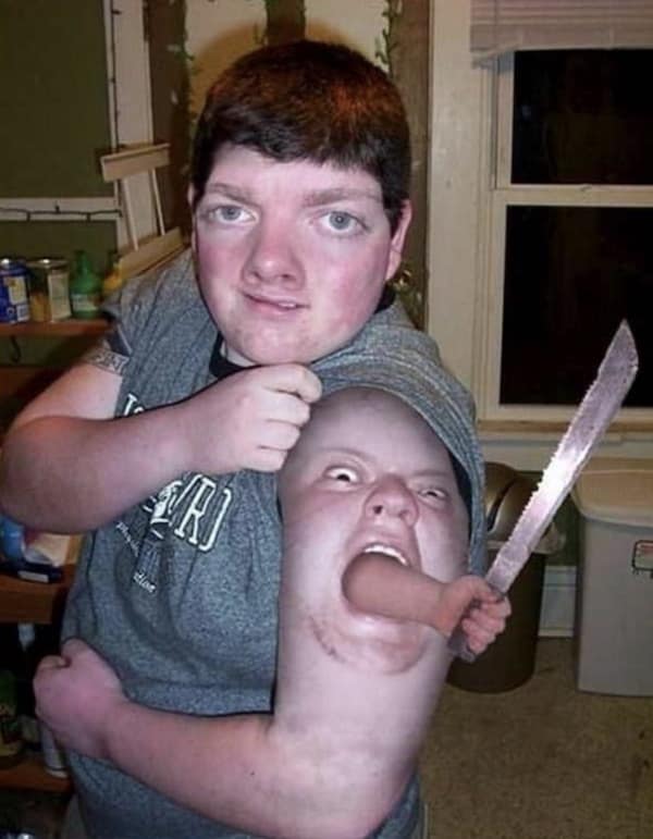 A bizarre photoshop of a man with a screaming face tattooed on his bicep.