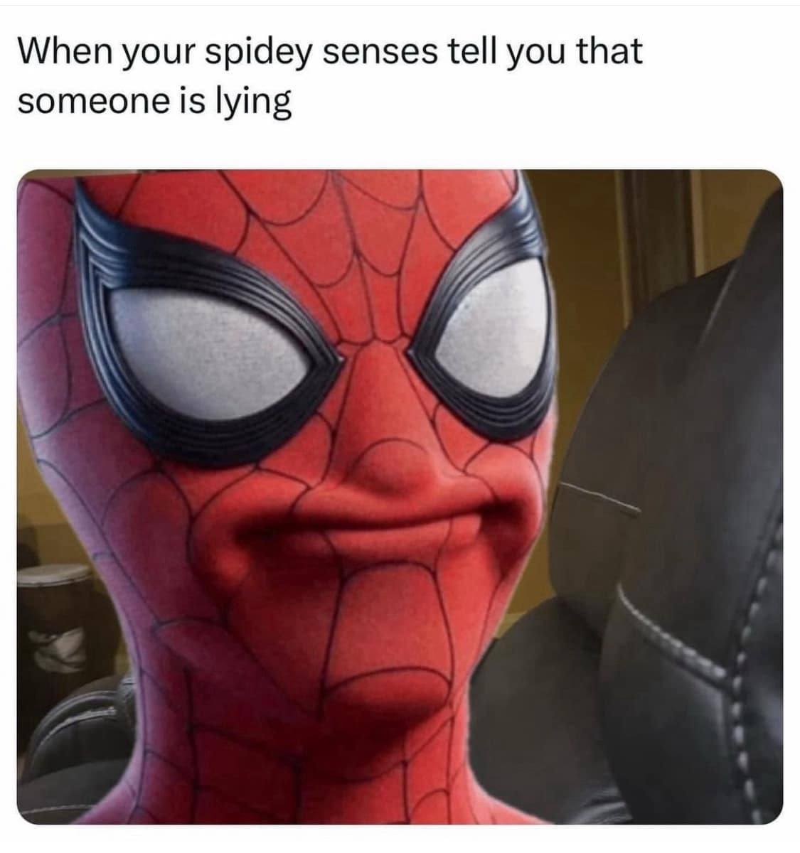 Spider-Man squints suspiciously with pursed lips as if his Spidey sense detected a lie.