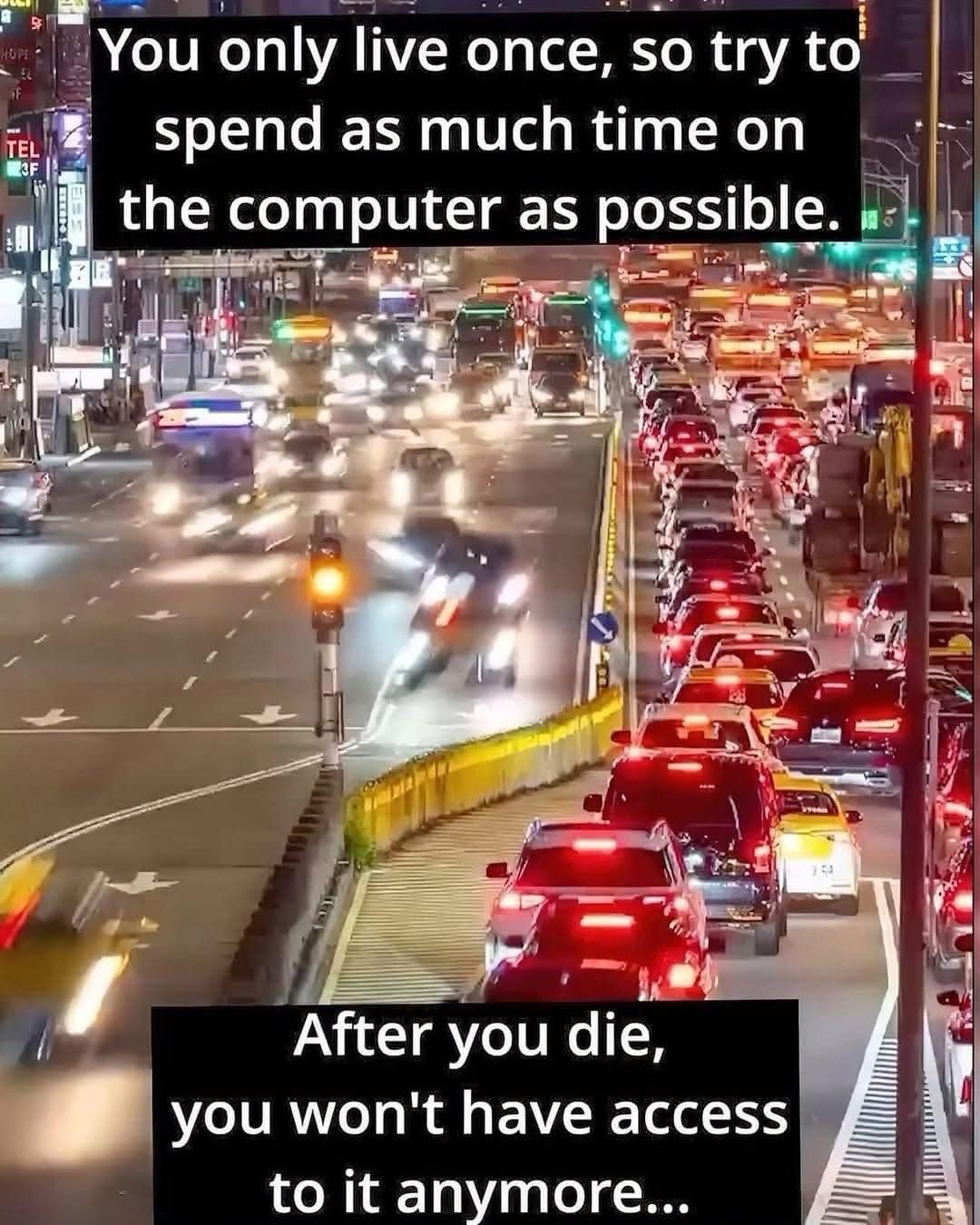 Night city traffic with caption advising to spend all your life on the computer because you won’t after you die.