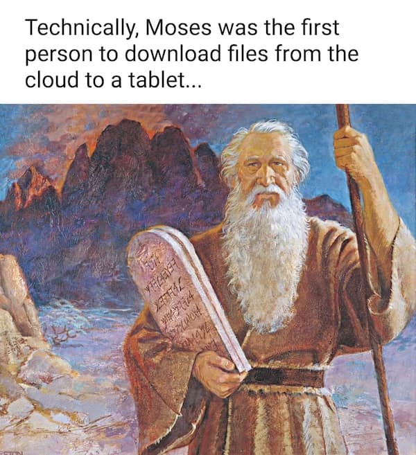 Moses holds stone tablets on a mountain; caption jokes about downloading from the cloud to a tablet.