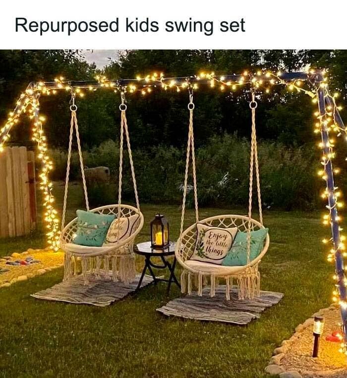 Backyard swing frame reinvented as two macramé chairs under fairy lights—weekend craft hacks done right.