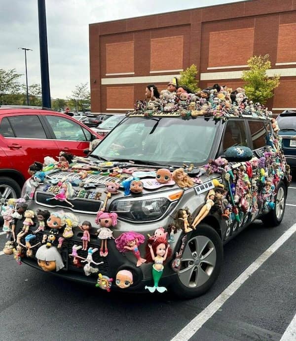 cursed cars covered entirely in toy dolls and figurines