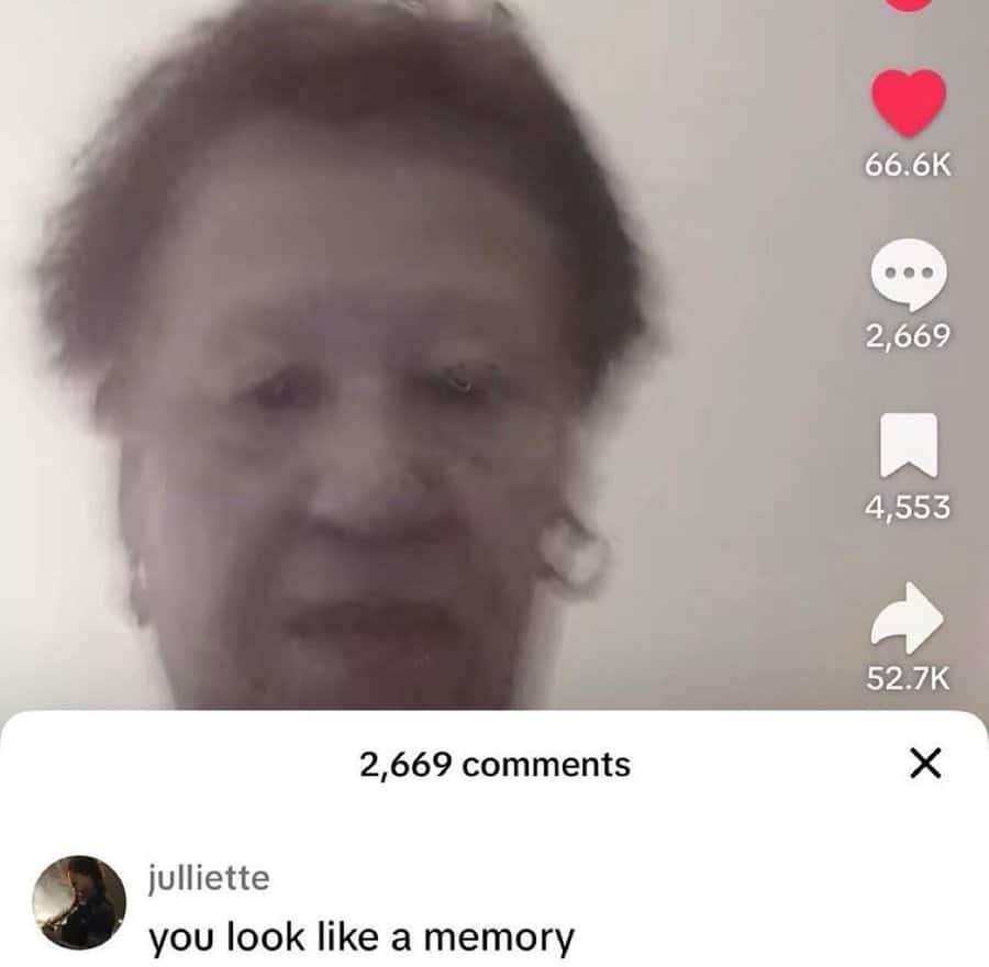 Blurry TikTok selfie of an older woman with a comment reading “you look like a memory.”