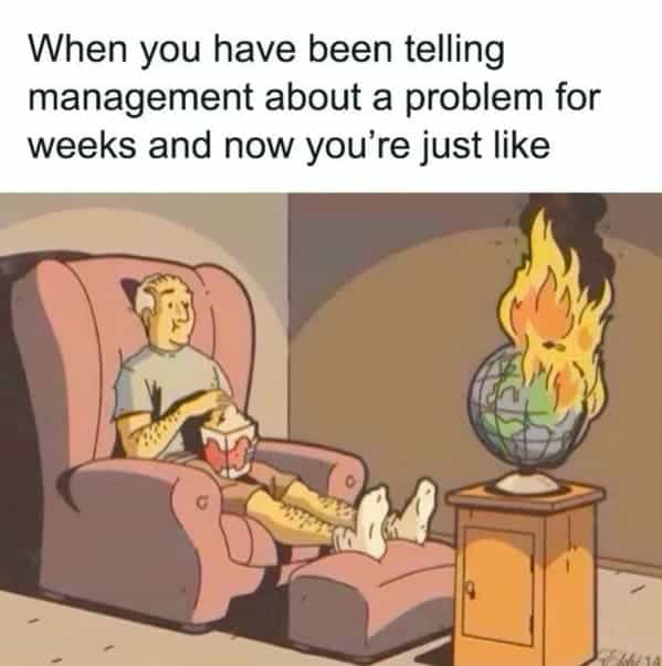 A dark humor work meme of a man watching the world burn after his warnings to management were ignored.