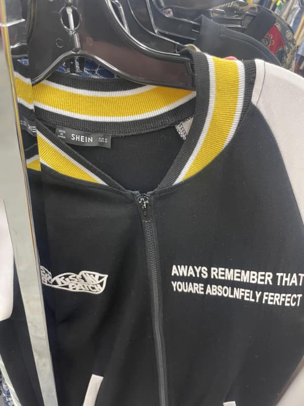 Jacket with motivational text riddled with errors