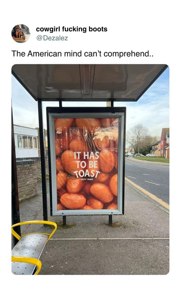 Ad at a British bus stop reading “It has to be toast” with baked beans