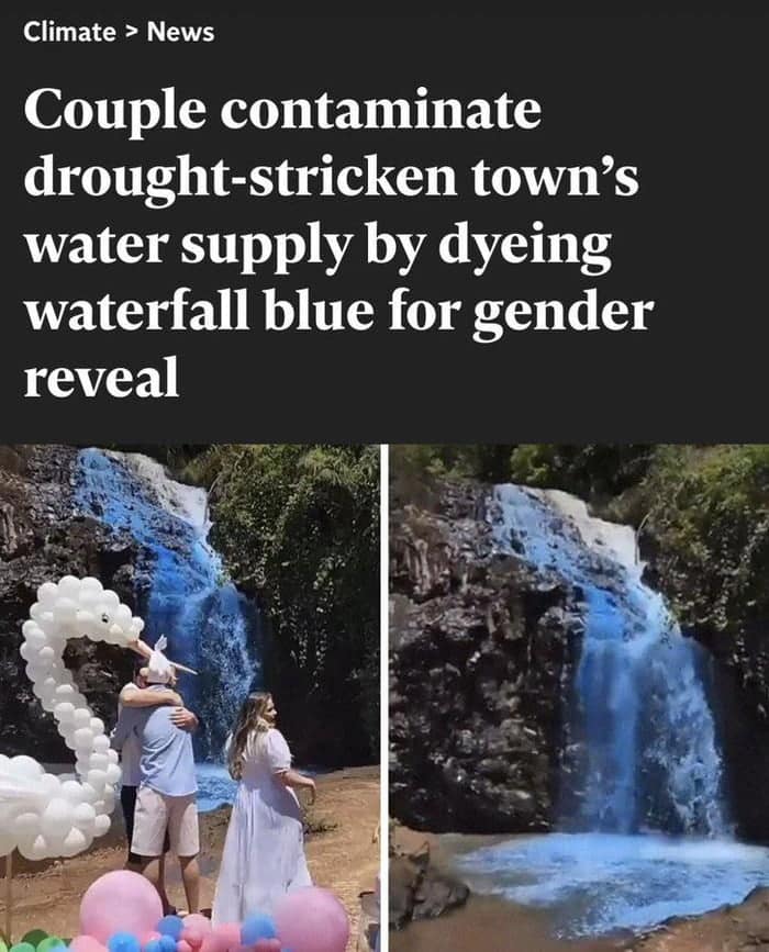 A couple at a gender reveal party standing by a waterfall dyed bright blue.