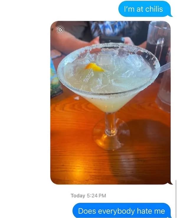 a margarita at Chili’s followed by the text “Does everybody hate me?”