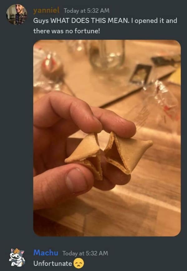 A person shows a fortune cookie with no fortune inside, asking what it means.