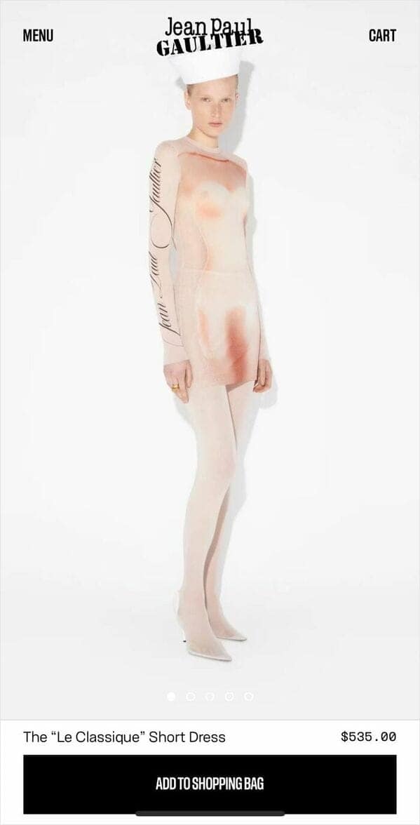 A Jean Paul Gaultier dress that is a fashion fail with a realistic naked torso print.