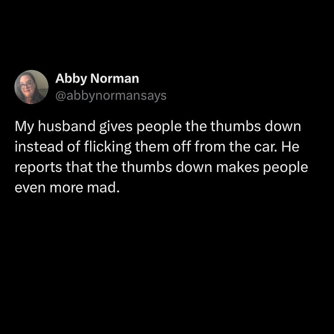 Man gives thumbs down from car instead of middle finger