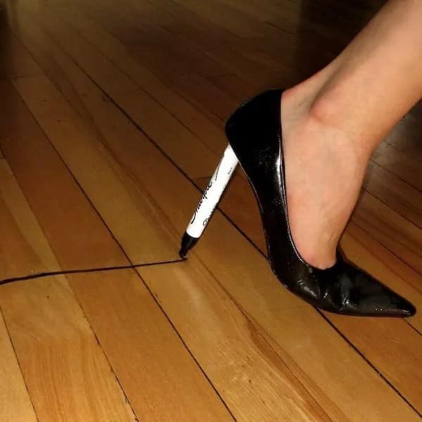 A funny meme and cursed image of a high heel shoe with a Sharpie marker for a heel.
