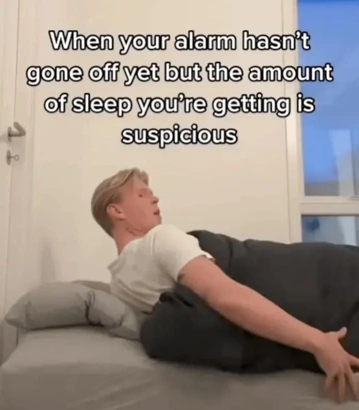 A funny meme about the suspicious feeling of getting too much sleep and missing your alarm.