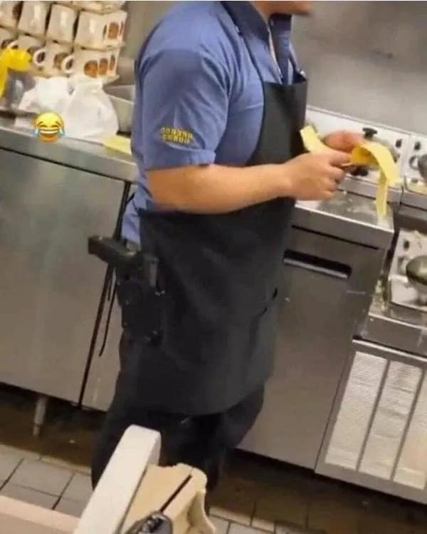Golden Corral employee with holstered gun peeling bananas